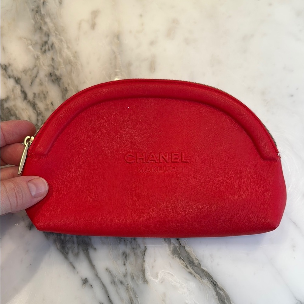 CHANEL Red Cosmetic Bag with Gold Zipper and Soft Fabric